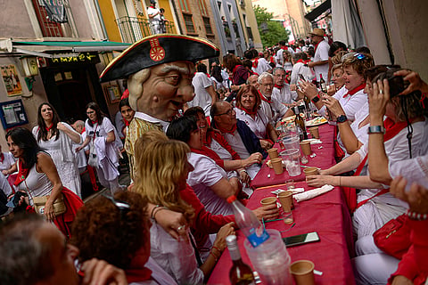 A member of San Fermin Giants poses for a photo 